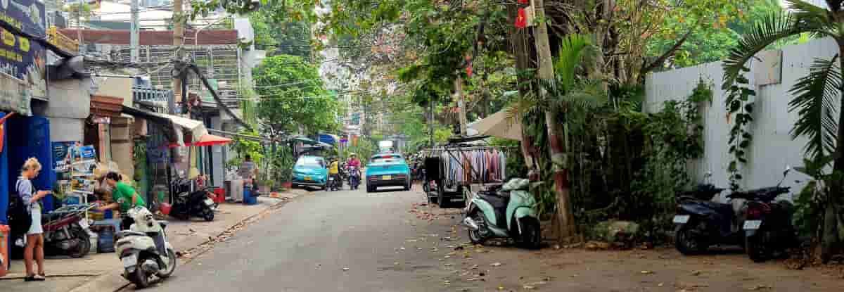 veryday neighborhood street in Saigon with local food stalls