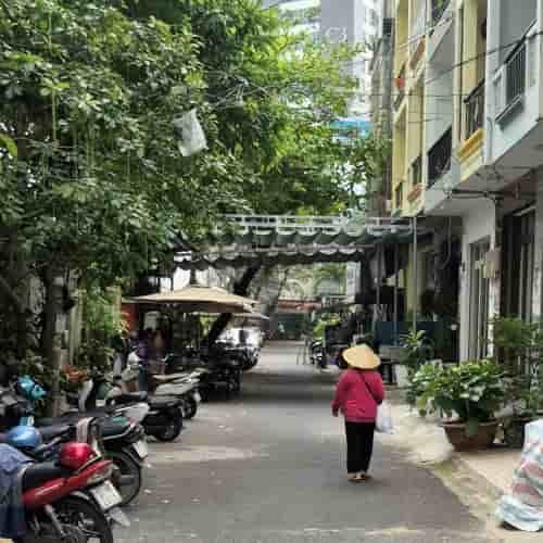 Quiet residential alley showing everyday local life in Saigon